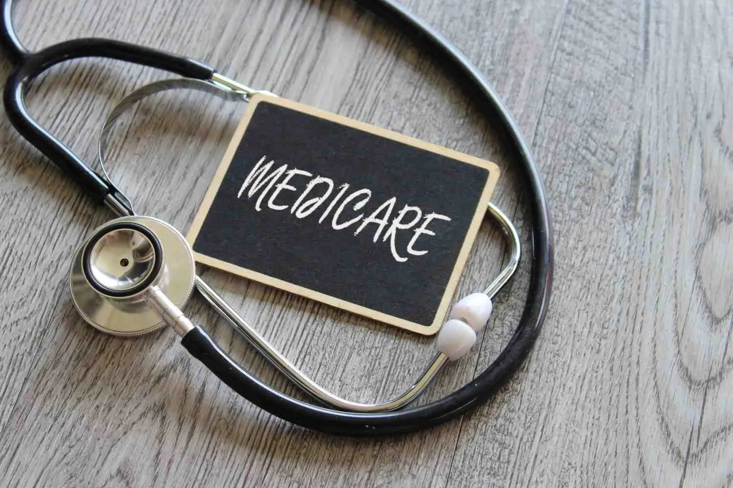An older adult talking through Medicare questions at a kitchen table